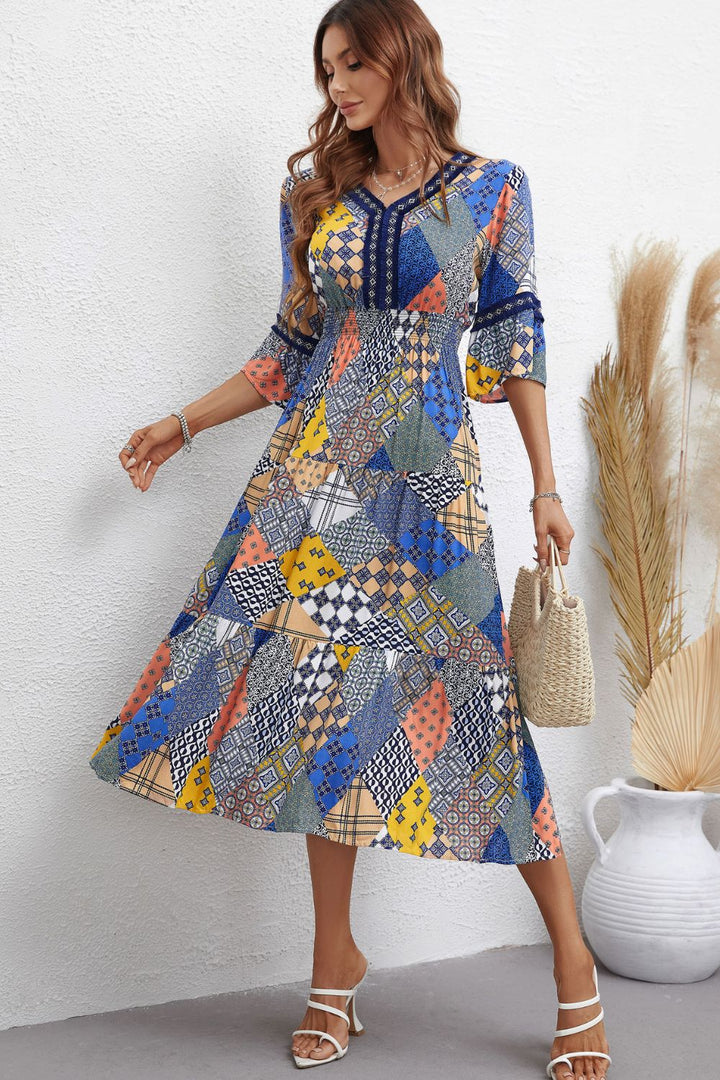 Rhapsody in Patchwork: V-Neck Tiered Midi Dress