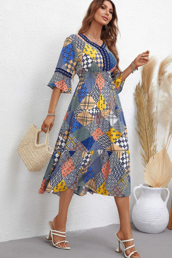 Rhapsody in Patchwork: V-Neck Tiered Midi Dress