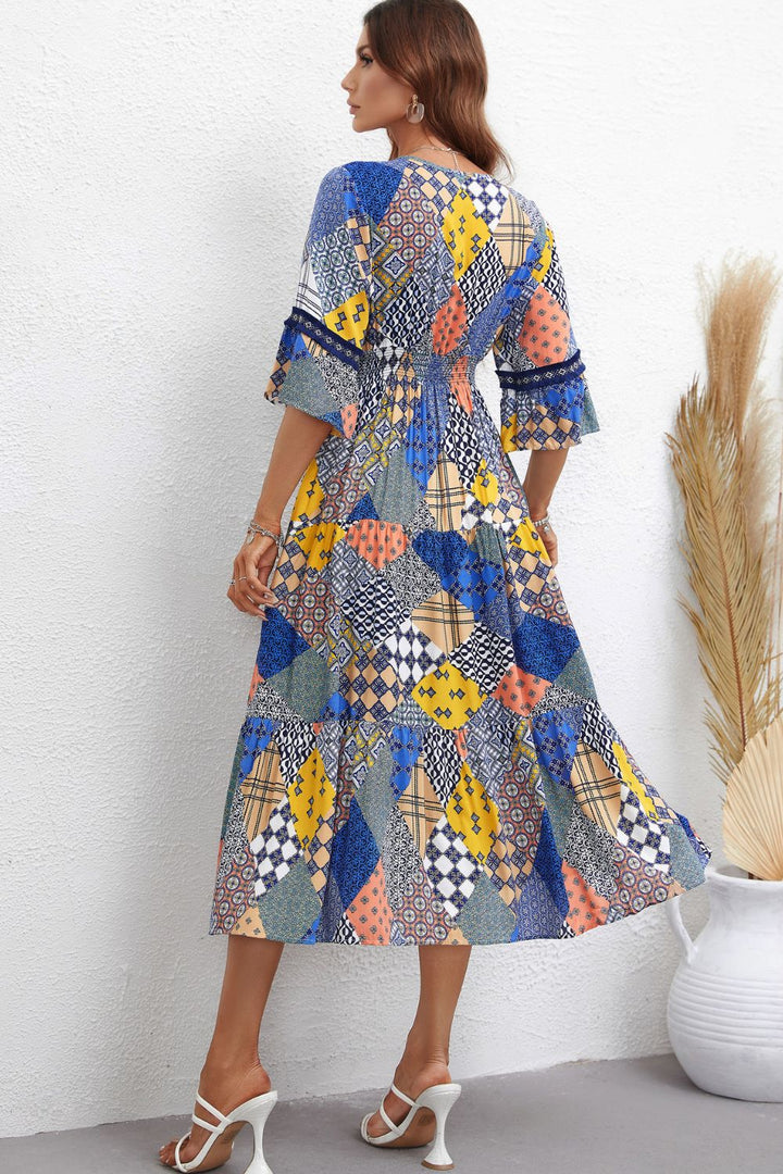 Rhapsody in Patchwork: V-Neck Tiered Midi Dress