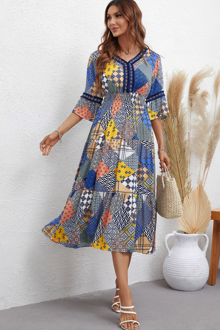 Rhapsody in Patchwork: V-Neck Tiered Midi Dress