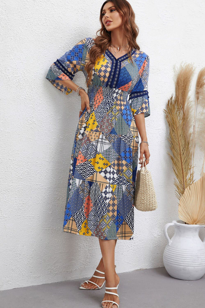 Rhapsody in Patchwork: V-Neck Tiered Midi Dress